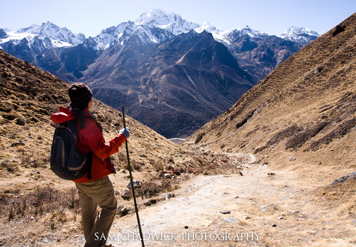 A woman looks out across the mountains of Nepal