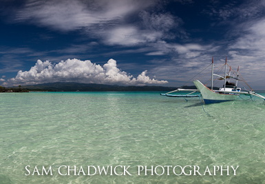 Horizontal panorama of boat in clear water in the Phillipines